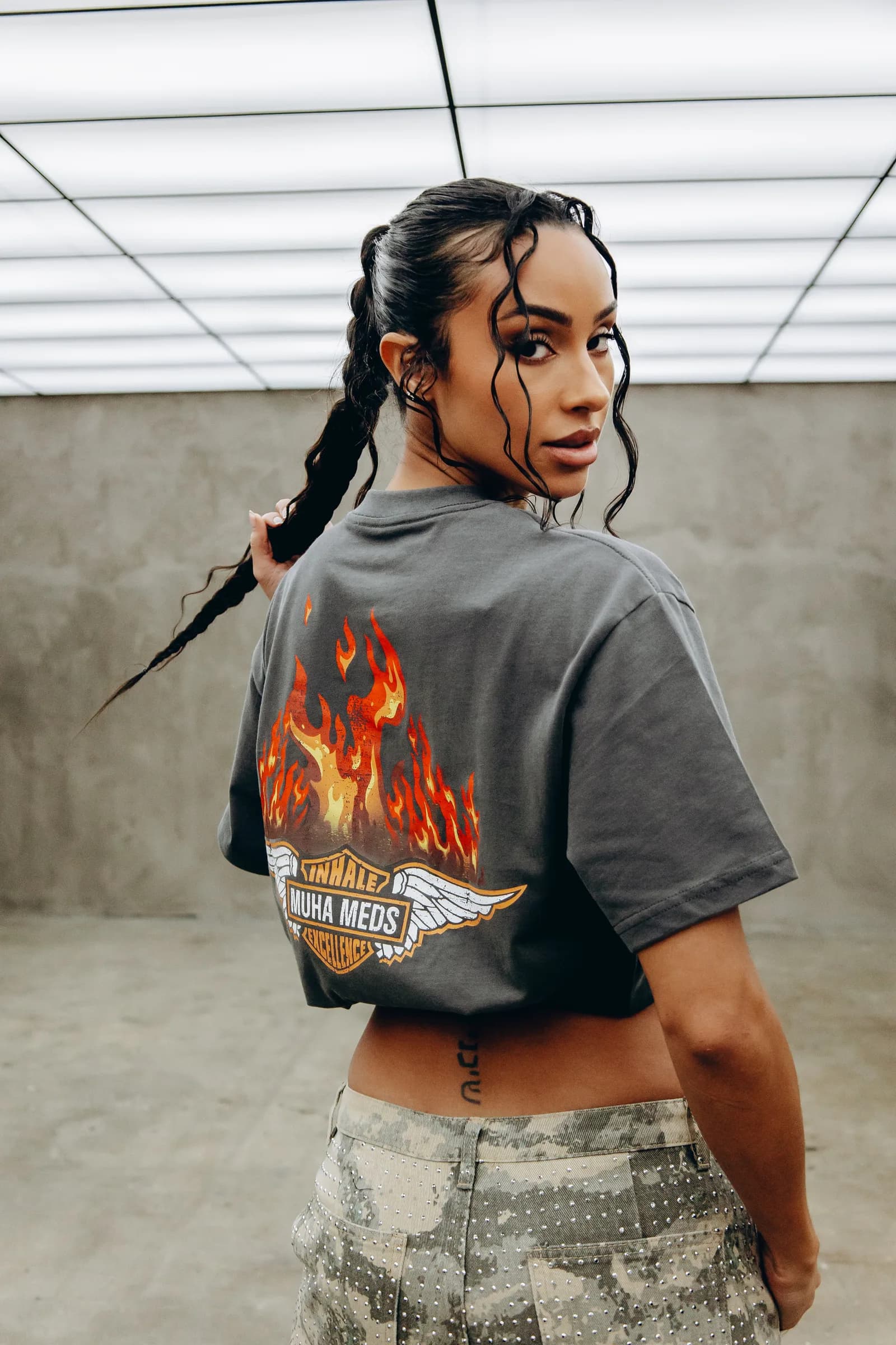 Muha Meds tee — winged flames